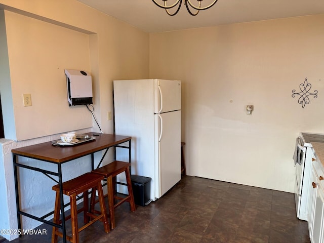 61 W Houston Ave, Montgomery, PA 17752 - kitchen featuring white appliances, a chandelier, and white cabinets