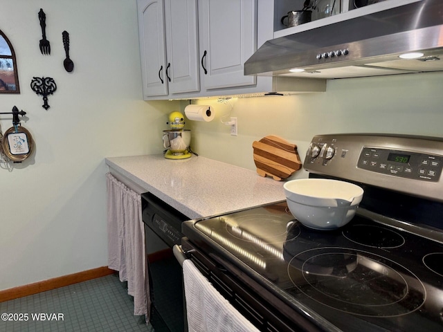 61 W Houston Ave, Montgomery, PA 17752 - kitchen featuring stainless steel electric range oven, range hood, tile patterned floors, black dishwasher, and light countertops