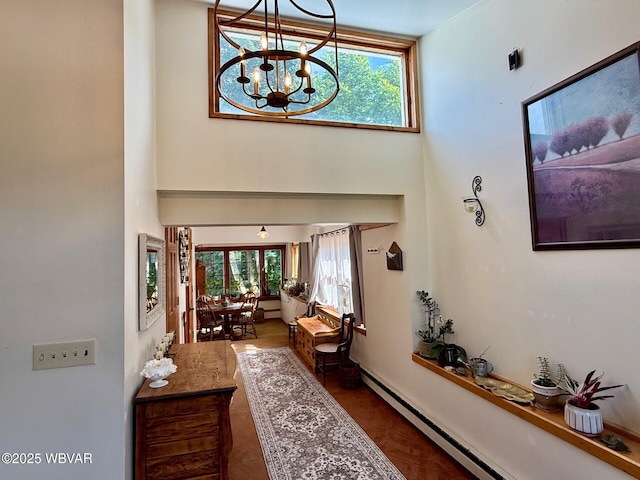 61 W Houston Ave, Montgomery, PA 17752 - entrance foyer featuring a baseboard radiator, a towering ceiling, and a chandelier