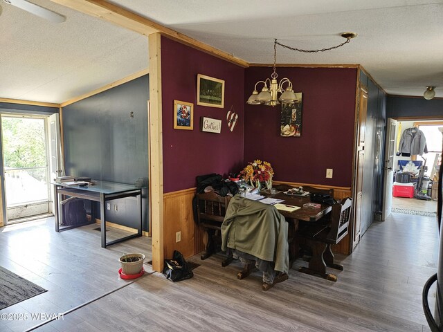 93 Woodside Rd, Danville, PA 17821 - dining space featuring a chandelier, crown molding, wood finished floors, wainscoting, and a textured ceiling