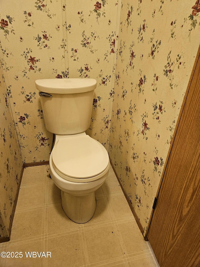 93 Woodside Rd, Danville, PA 17821 - bathroom with wallpapered walls, toilet, and baseboards