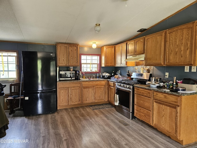 93 Woodside Rd, Danville, PA 17821 - kitchen with stainless steel appliances, under cabinet range hood, dark wood finished floors, and brown cabinetry