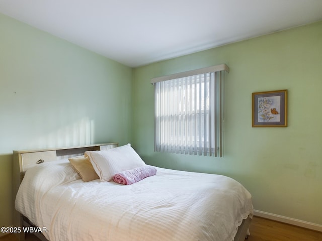 bedroom featuring hardwood / wood-style floors