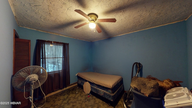 bedroom featuring dark colored carpet and ceiling fan