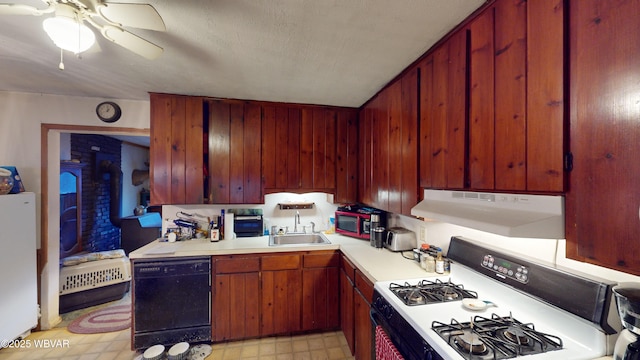 kitchen with white refrigerator, sink, gas range oven, black dishwasher, and ceiling fan