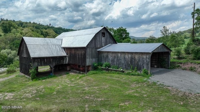 view of outdoor structure featuring a lawn