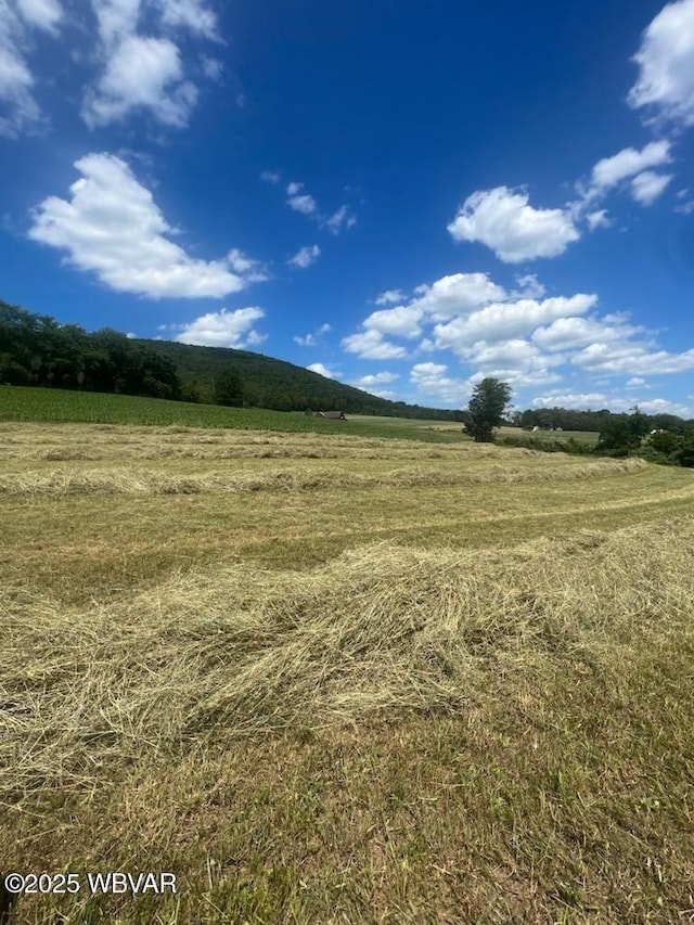 exterior space with a rural view