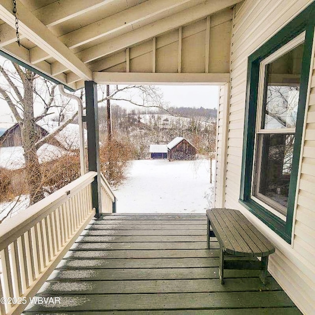 view of snow covered deck