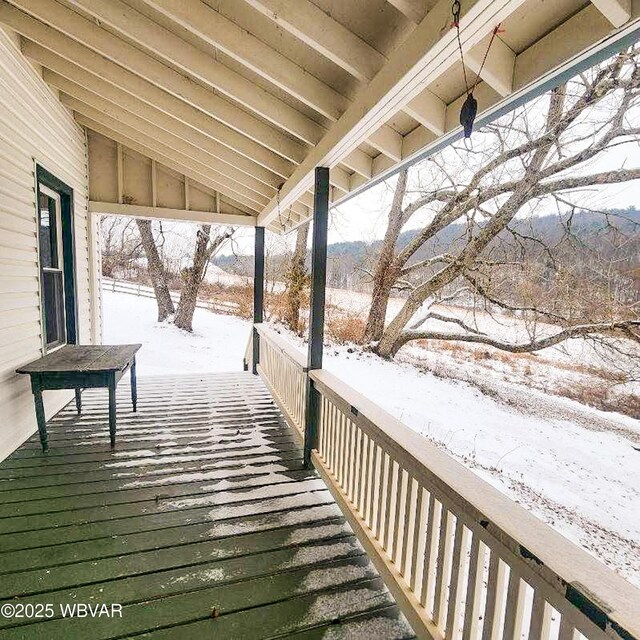 view of snow covered deck