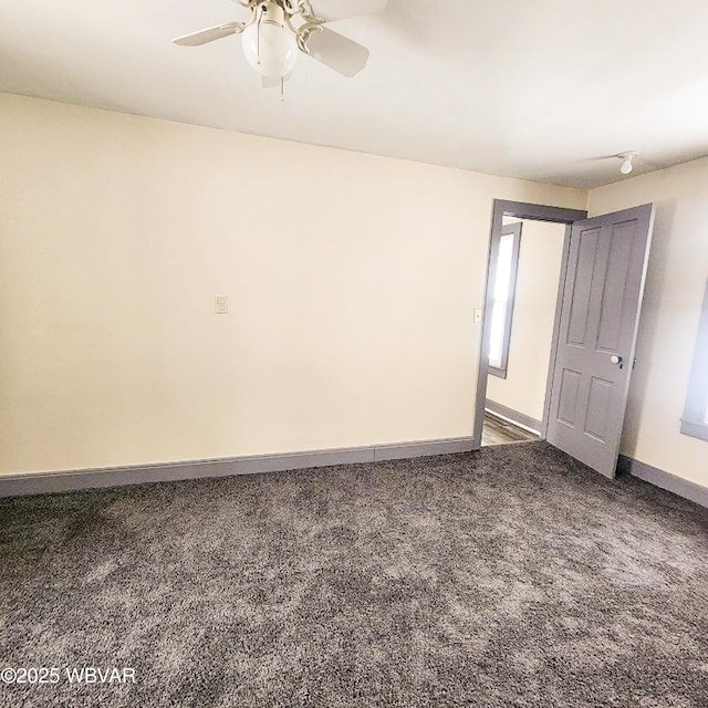 carpeted empty room with ceiling fan