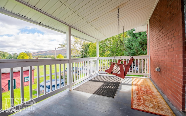 wooden terrace with a mountain view