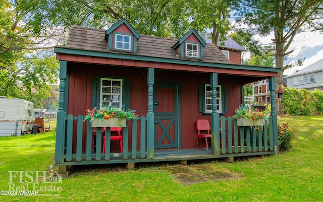 view of outbuilding featuring a yard