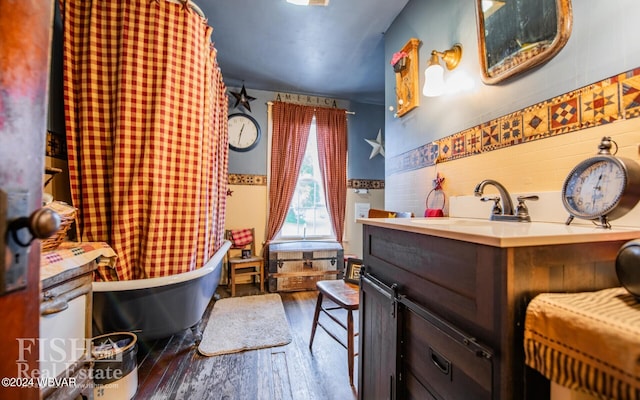 bathroom with vanity, wood-type flooring, and shower / bath combo with shower curtain