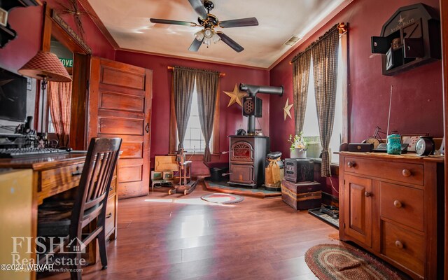 home office with ceiling fan, ornamental molding, and light hardwood / wood-style flooring