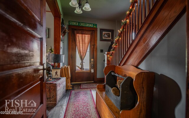 foyer entrance featuring an inviting chandelier