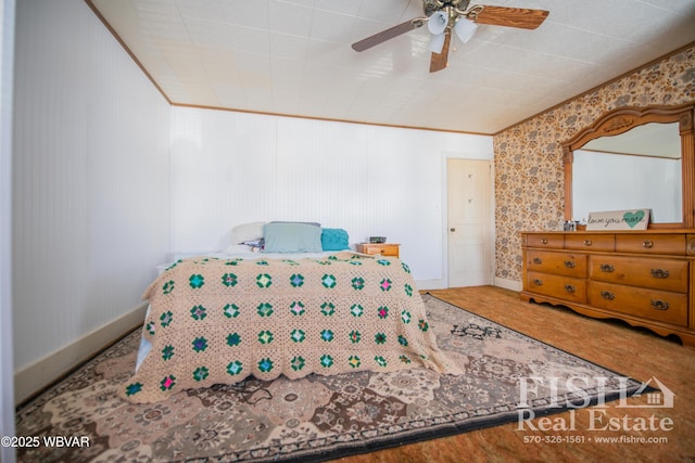 bedroom with ceiling fan and crown molding