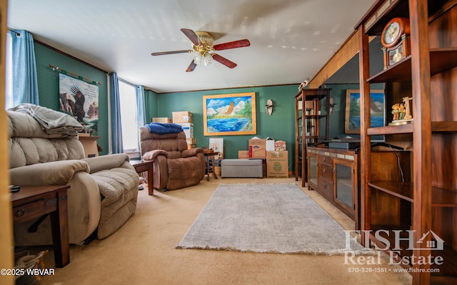 sitting room featuring ceiling fan and light colored carpet