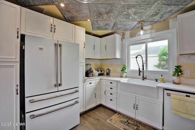 2177 N Williamson Rd, Covington, PA 16917 - kitchen featuring freestanding refrigerator, dishwasher, an ornate ceiling, a sink, and white cabinetry
