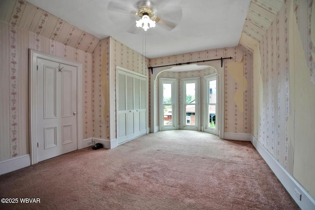 2177 N Williamson Rd, Covington, PA 16917 - unfurnished bedroom featuring wallpapered walls, carpet floors, access to exterior, and ceiling fan