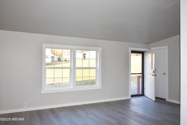 unfurnished room with dark hardwood / wood-style floors