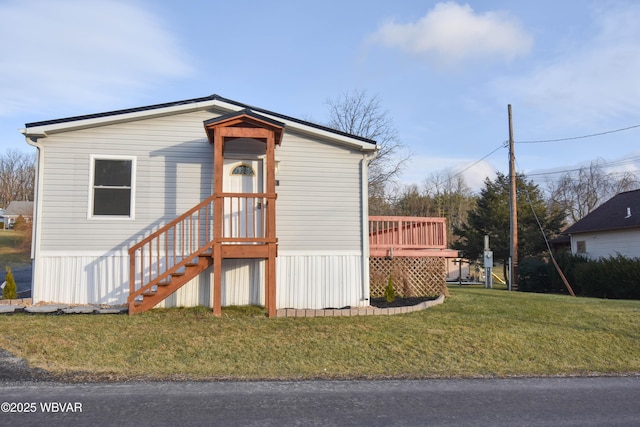 exterior space with a deck and a front lawn