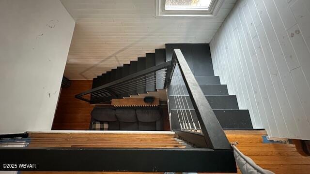 staircase with wood finished floors