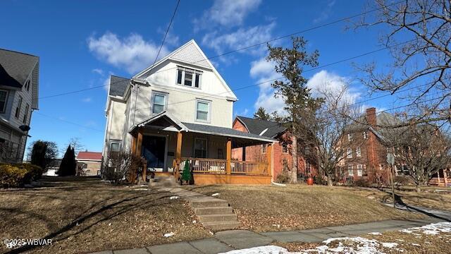 view of front of home featuring covered porch and stucco siding