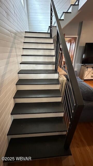 stairs with wood finished floors