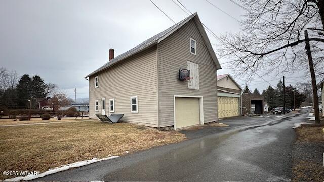 view of home's exterior with a chimney