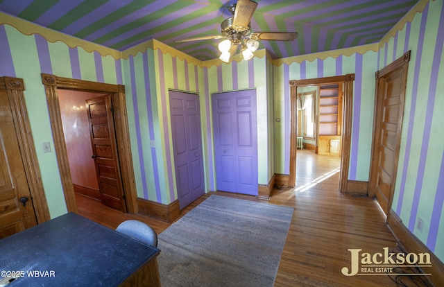 bedroom featuring ceiling fan and wood-type flooring