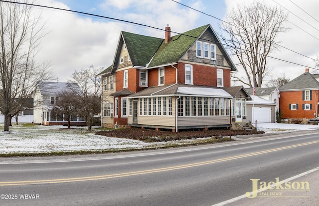 view of front of property with a sunroom