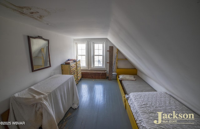 bedroom with dark wood-type flooring