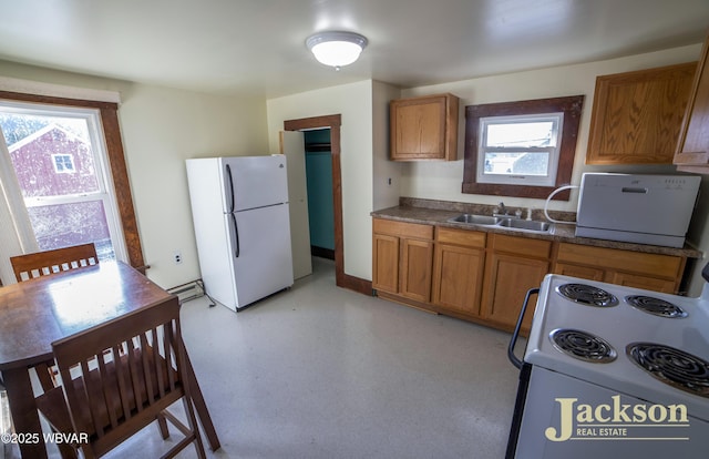 kitchen with sink and white appliances