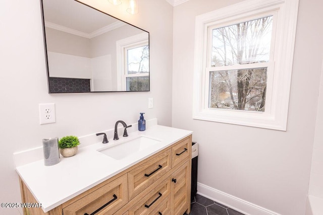 bathroom with tile patterned floors, baseboards, ornamental molding, and vanity