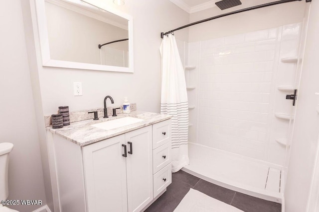 full bath featuring vanity, ornamental molding, a tile shower, and tile patterned floors