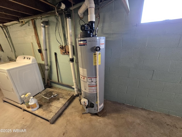 basement featuring washer / clothes dryer and water heater