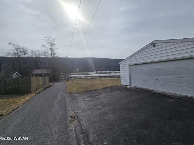 garage with aphalt driveway