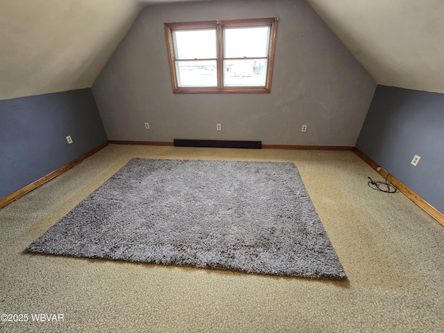 bonus room with vaulted ceiling, baseboards, and baseboard heating