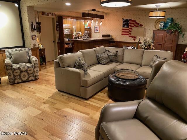 1550 Campbell St, Williamsport, PA 17701 - living room with wallpapered walls and light wood-style floors