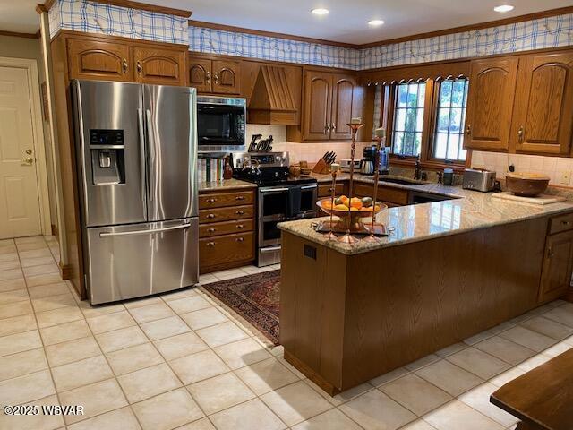 1550 Campbell St, Williamsport, PA 17701 - kitchen with crown molding, stainless steel appliances, a peninsula, light tile patterned floors, and custom range hood