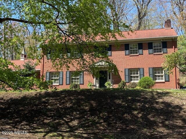 1550 Campbell St, Williamsport, PA 17701 - colonial house with brick siding and a chimney