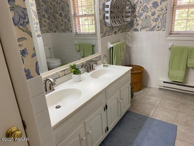 1550 Campbell St, Williamsport, PA 17701 - bathroom featuring a sink, wainscoting, and wallpapered walls