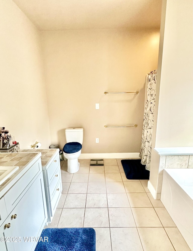 2035 Woodland Rd, Montoursville, PA 17754 - bathroom with tile patterned flooring, vanity, a bath, toilet, and baseboards