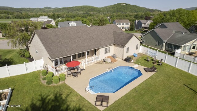 2035 Woodland Rd, Montoursville, PA 17754 - view of swimming pool featuring a patio area, a residential view, a mountain view, and outdoor dining area