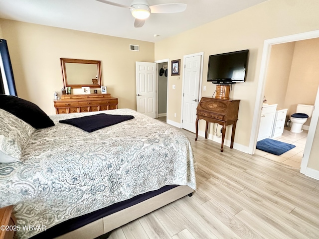 2035 Woodland Rd, Montoursville, PA 17754 - bedroom with light wood finished floors, baseboards, ensuite bathroom, and ceiling fan
