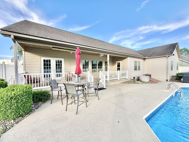 2035 Woodland Rd, Montoursville, PA 17754 - back of property featuring a patio, french doors, fence, and roof with shingles