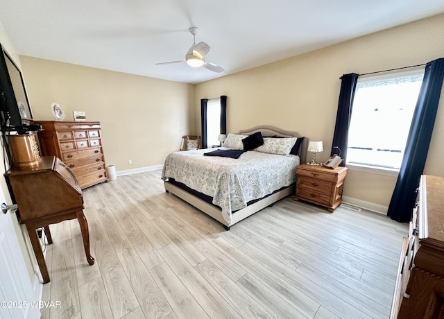 2035 Woodland Rd, Montoursville, PA 17754 - bedroom with light wood-style flooring, baseboards, and a ceiling fan