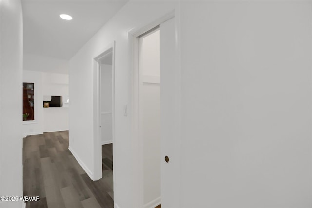 hallway with dark wood-type flooring