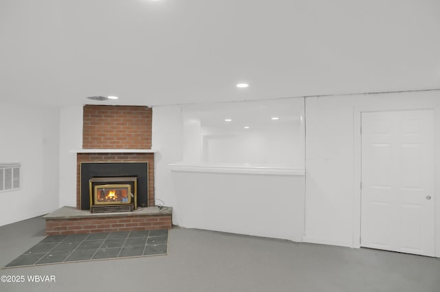 unfurnished living room with a brick fireplace