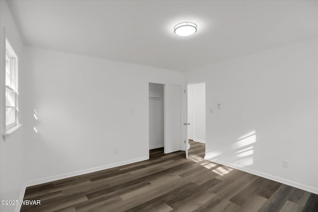 unfurnished room featuring dark hardwood / wood-style flooring